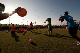 Students throwing dodgeballs