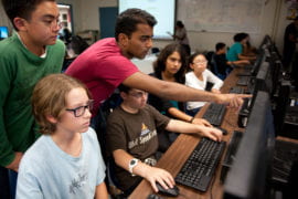 Naren Sathiya helping middle school students
