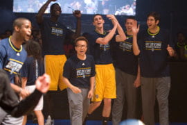 Men's Basketball team cheering during 3 point contest