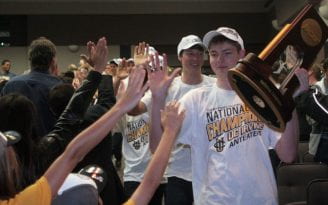 Collin Mehring with the NCAA trophy