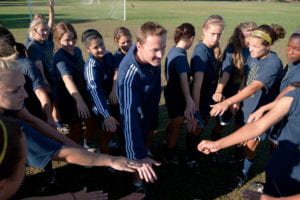 Scott Juniper with the women's soccer team
