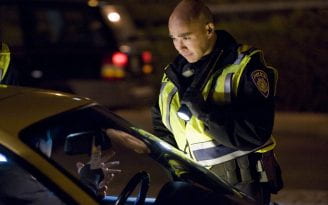 Chris Bolano chats with a motorist at a DUI checkpoint