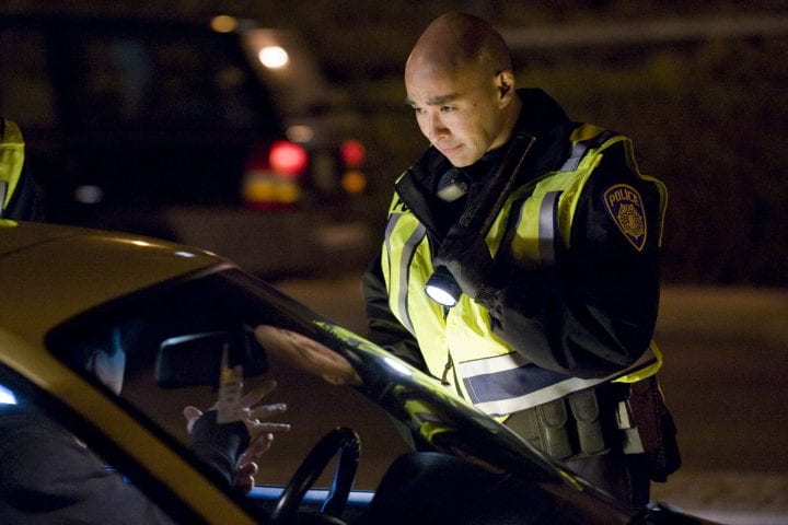 Chris Bolano chats with a motorist at a DUI checkpoint