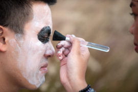 Chris Vo getting costume makeup applied
