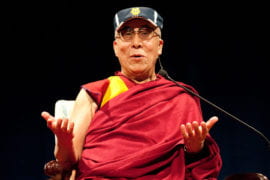 the Dalai Lama sporting an Anteaters visor