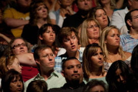 Audience members listen intently to the Dalai Lama’s address.