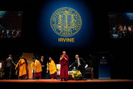 The Dalai Lama greets audience members