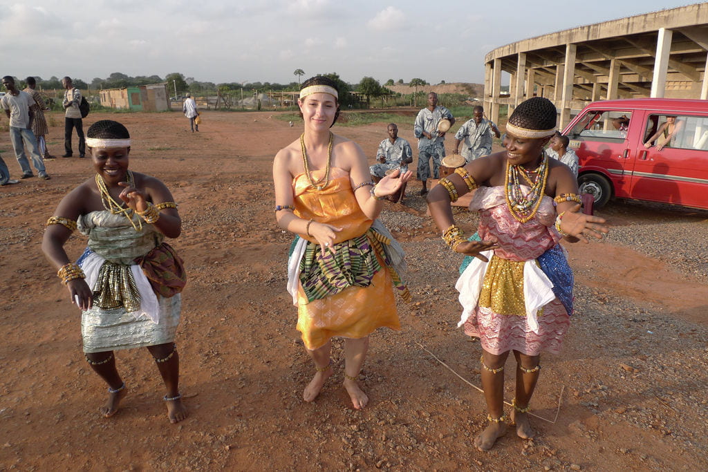 Jenna Tatone performs Adowa, a royal dance of the Ashanti people, with Ghana Dance Ensemble dancers