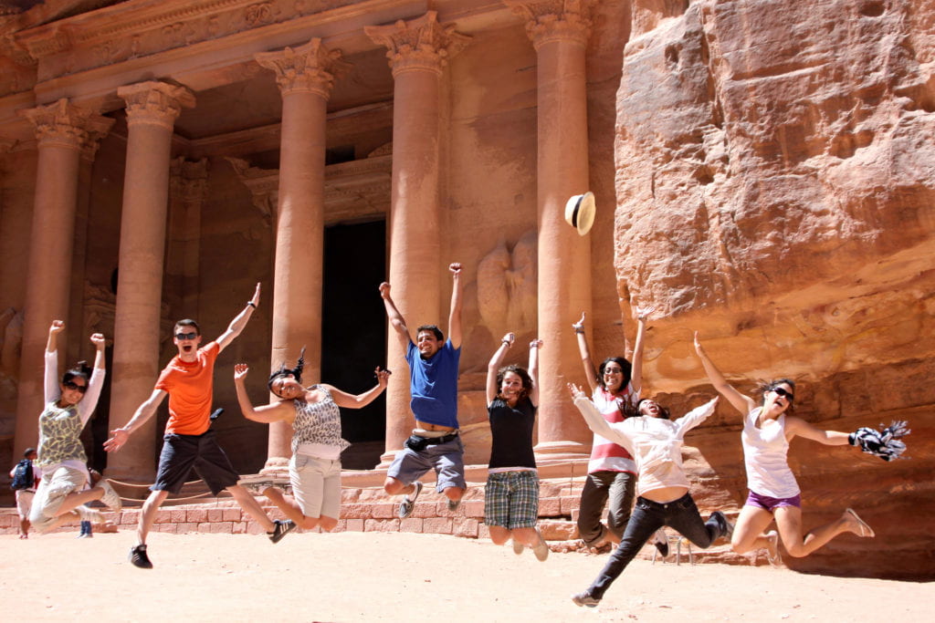 Olive Tree Initiative students pose in front of the ancient Treasury landmark in Petra