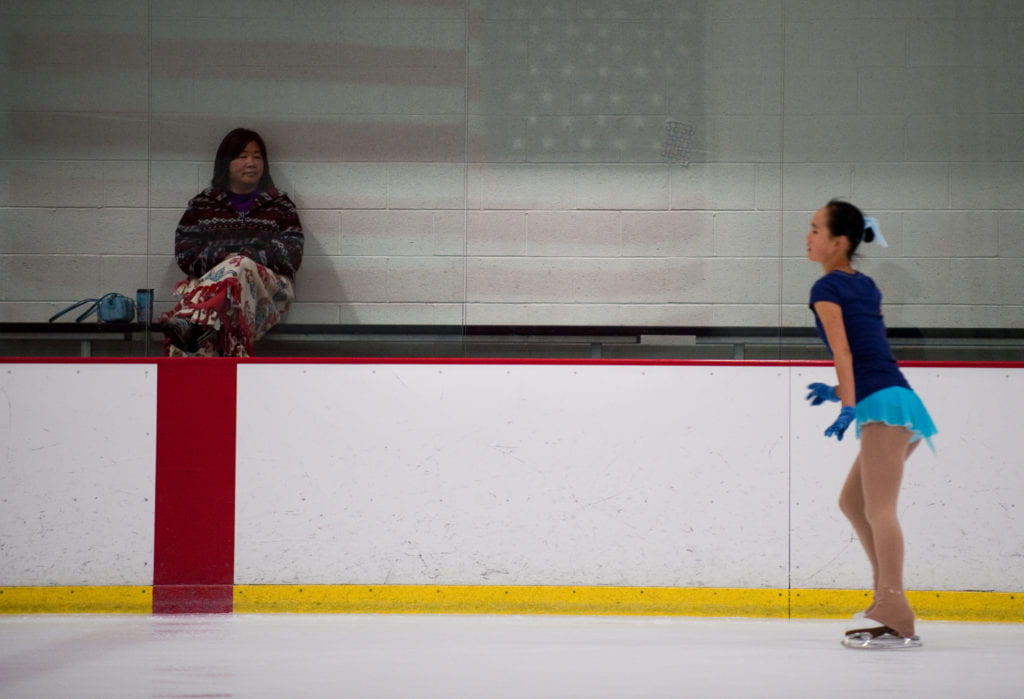 Zhou's mother watching her skate