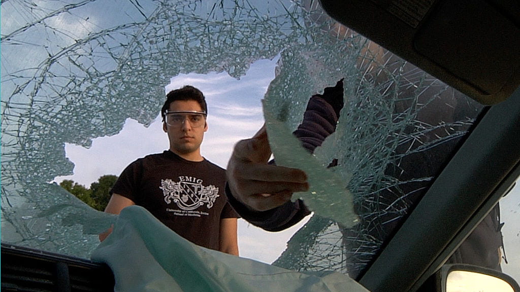 Ashkan Akasheh prepares a mangled Honda Civic