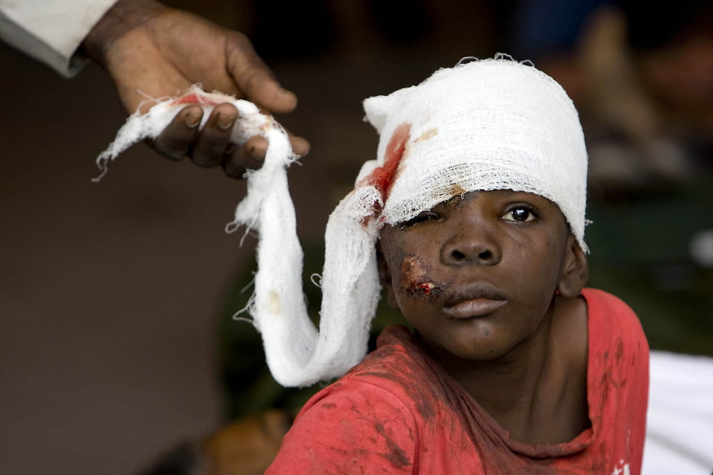 a Haitian boy receives treatment at a medical clinic at the United Nations Stabilization Mission's logistics base