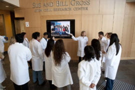Here, CIRM fellows are briefed before leading guest tours of the new facility.