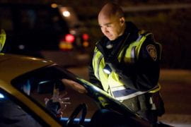 Officer Christopher Bolano chats with a motorist
