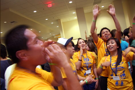 Student staffers lead a cheer for incoming freshmen