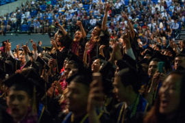 Grads cheer during commencement for the School of Social Sciences.