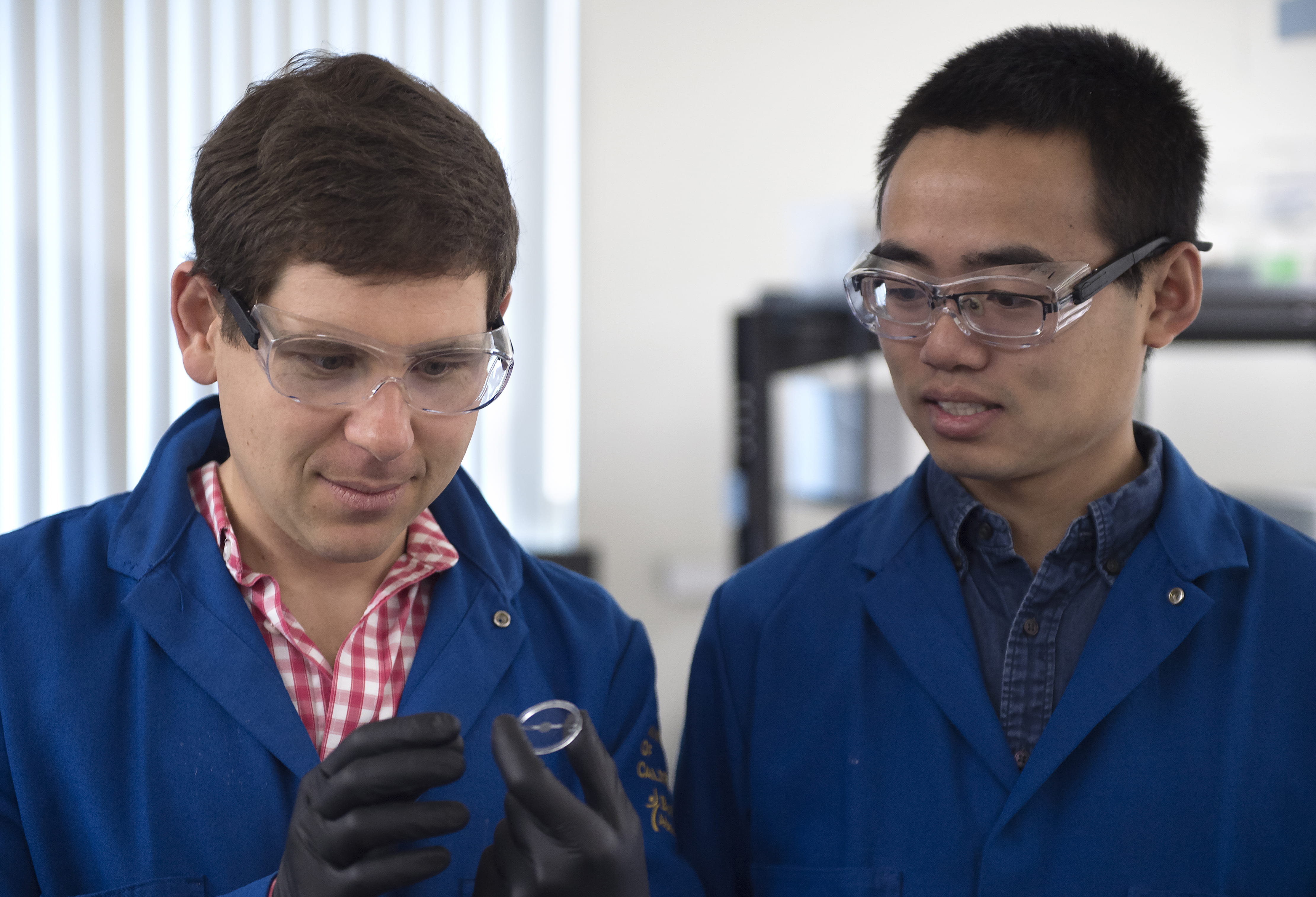 Associate Professor of Chemical Engineering & Materials Science Alon Gorodetsky and grad student Chengyi X