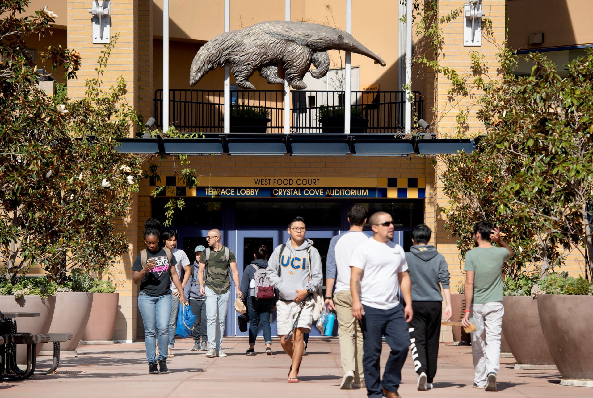 People entering and exiting the UCI Student Center.