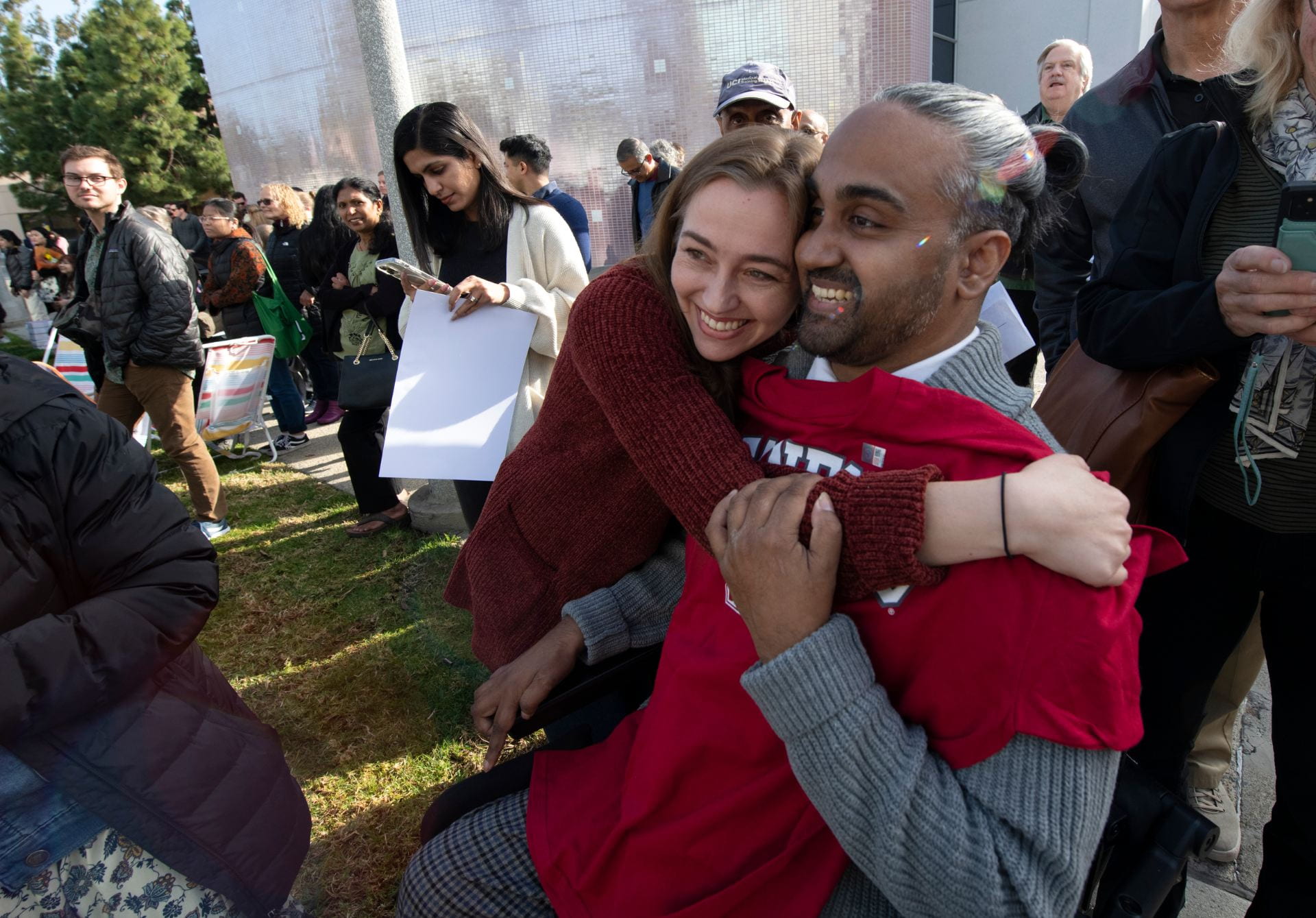 Hinesh Patel (right) gets a congratulatory hug from his wife, Emma Bindloss, after finding out he’ll be going to Stanford University for a radiology and nuclear medicine residency.