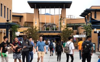 Students walk along the student center terrace during the first day of fall classes on the UCI campus.
