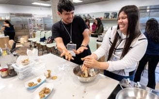Orange County high school students enjoy making energy bites under the direction of Chef Jessica VanRoo in the Susan Samueli Center for Integrative Health kitchen.
