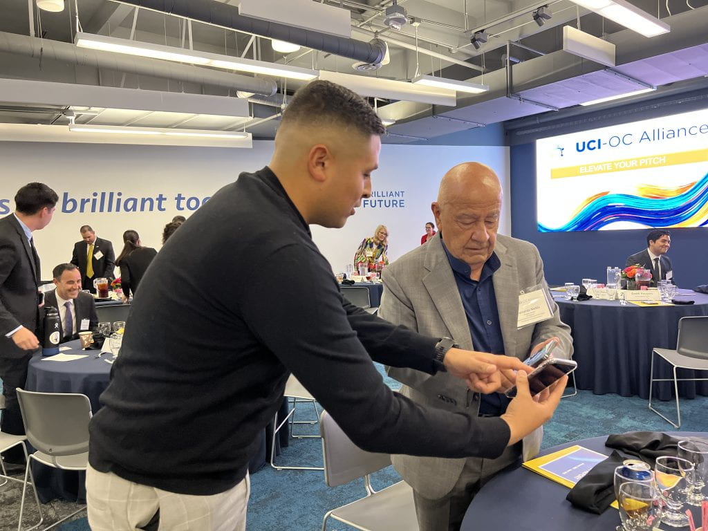 UCI-OC Alliance founding member Fernando Niebla meets with UCI student Christian Rabadan during an “Elevate Your Pitch” workshop.