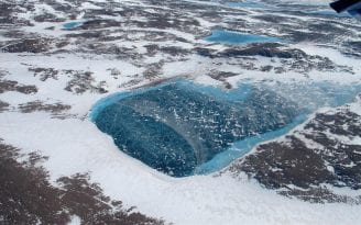 Greenland is dotted with frozen meltwater lakes such as the one above, photographed during a NASA expedition in 2012.