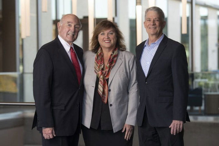 UCI’s Bernadette Boden-Albala, center, pictured with Irvine Health Foundation Board Chair Timothy L. Strader Sr., left, and President Edward B. Kacic, right.