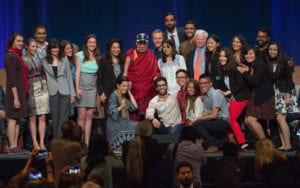 Mary Sargious, far right, poses for pictures with the XIV Dalai Lama during the Compassion Summit at UCI in July. Steve Zylius / UCI