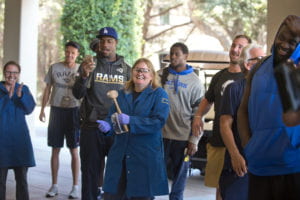 Associate Professor Jennifer Prescher demonstrates some chemistry in action for awe-struck L.A. Rams players during their summer training camp at UCI. Steve Zylius / UCI