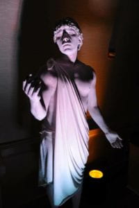 Joshua Romero plays a marble Greek sculpture